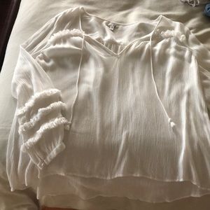 This is a white blouse from AMUSE, sold at jacks